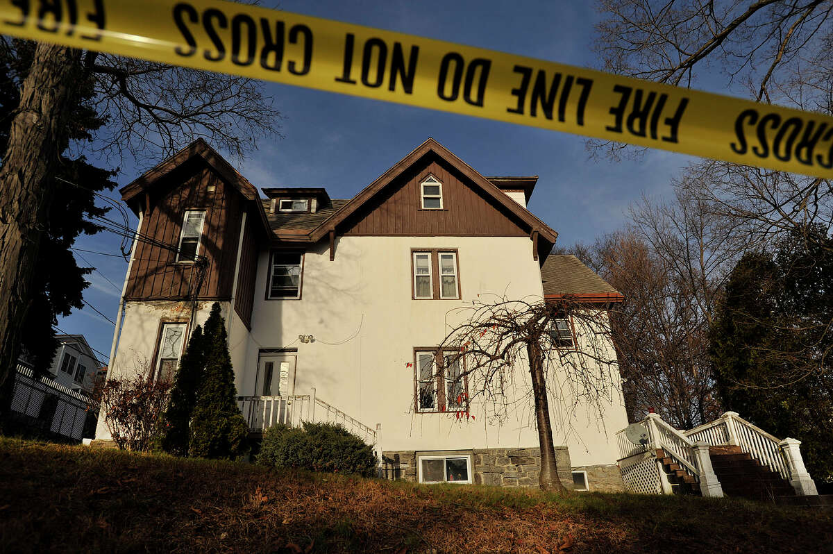 The multi-family house at 52 Highland Road in Stamford, Conn., is pictured on Thursday, Dec. 4, 2014. On Dec. 3, police say the owner, Anthony Manousos, allegedly set fire to the building with a tenant still inside.