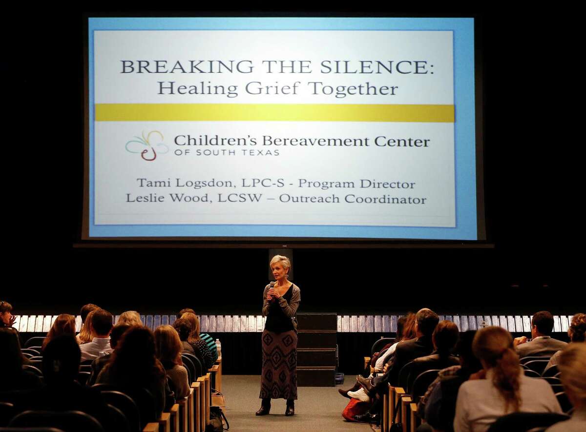 Children's Bereavement Center of South Texas Executive Director Marian Sokol (center) along with officials from Alamo Heights Independent School District address concerned parents and citizens during a discussion on how young people grieve in the wake of a suicide by Alamo Heights High School student David Molak at the district's Junior School on Wednesday, Jan. 20, 2016. About 35 people gathered to hear how adults should understand and cope with a child's grieving process. Officials including a parent held symbolically-lit candles to conclude the discussion.