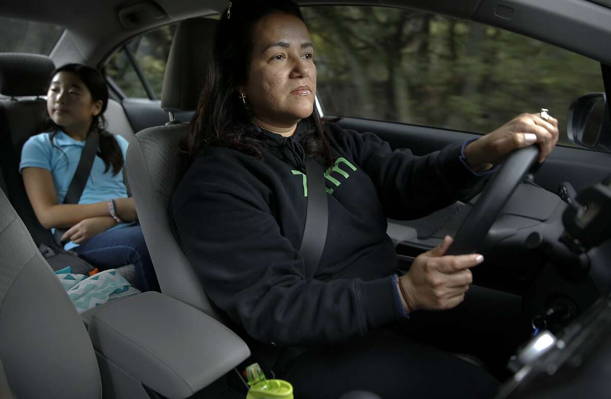 Zum driver Marcia Bravo drives seventh grade student Ellie to her San Mateo home after being picked up from school in Portola Valley, Calif., on Wed. January 20, 2016. Zum, which has childcare providers giving rides to kids are also be available to watch them in their homes.