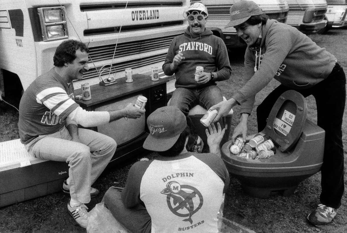 Four 49ers fans set up camp at Stanford Stadium, Jan. 19, 1985, in preparation for Super Bowl XIX game between the Miami Dolphins and their favorite team from San Francisco. The fans are, clockwise from top, Frank Mullin, Ernest Franco, Willie Wood and Al Gershooney. (AP Photo/Barry Sweet)