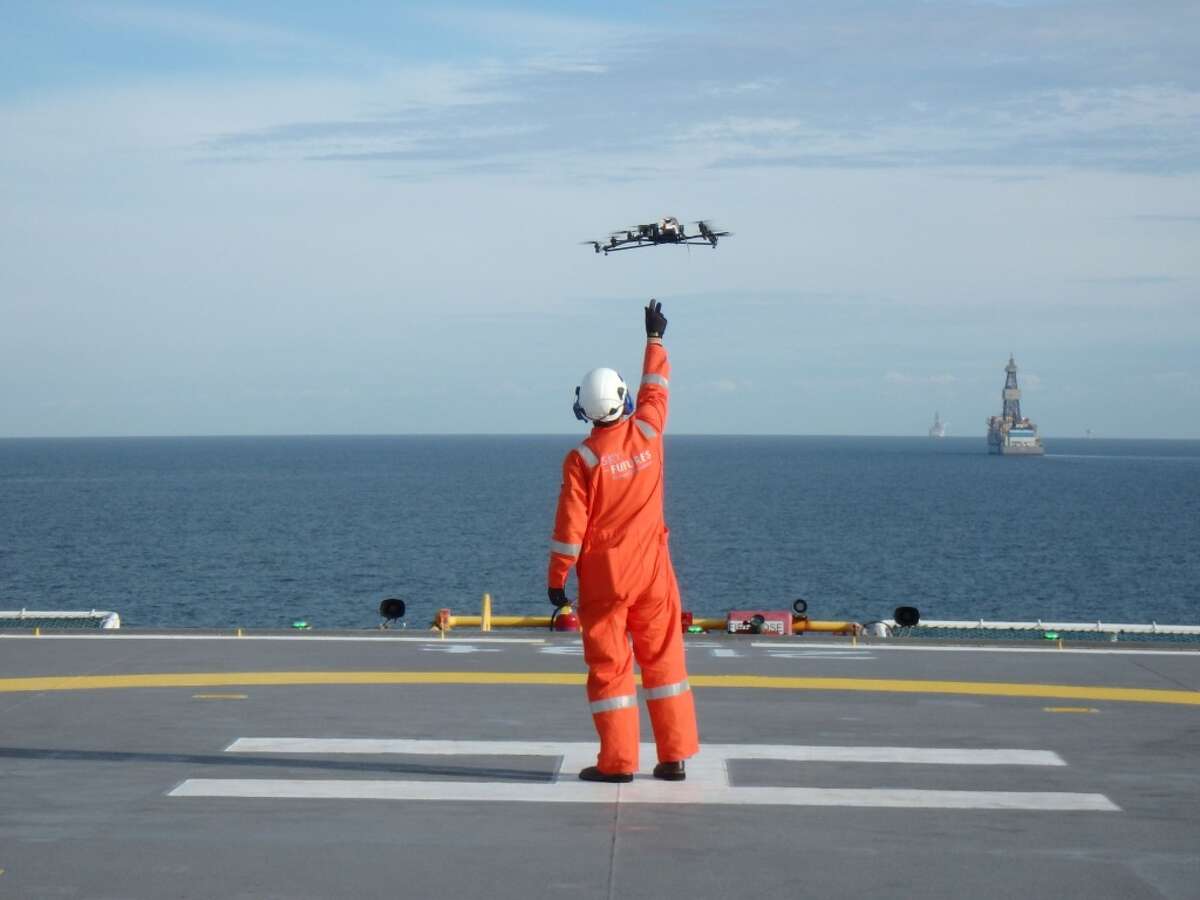 Sky Futures pilots operate a drone on the deck of an oil platform in the Gulf of Mexico in September 2015. (Sky Futures)