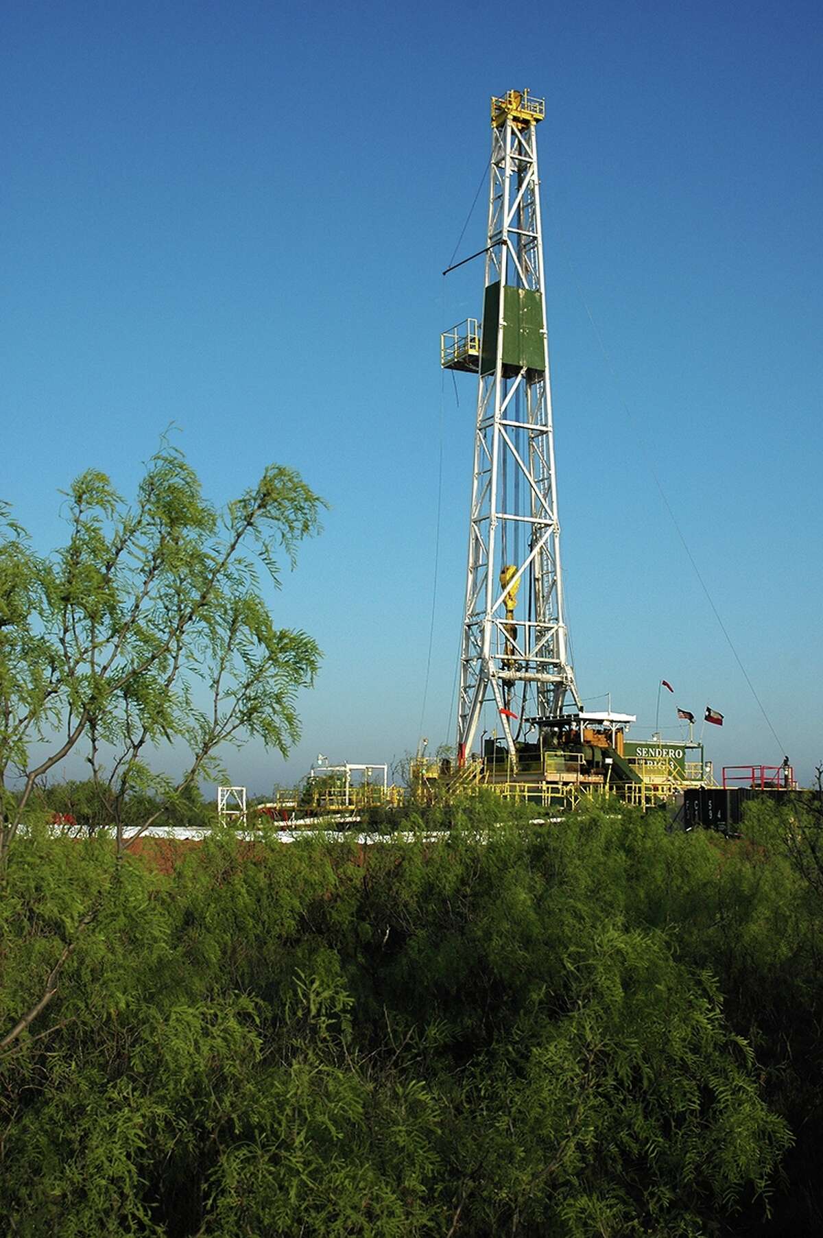 A Pioneer Natural Resources rig works at a Martin County site in the Permian Basin, which is still able to attract investors because it has been active for decades.