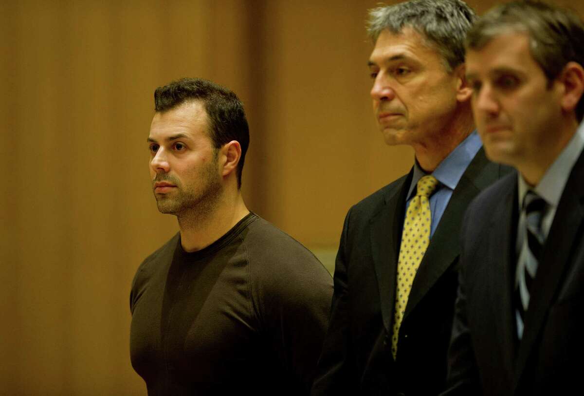 At his arraignment on an arson charge in December 2014, Anthony Manousos, 34, appears in State Superior Court with his attorneys, Frank DiScala, center and Mike Skiber, right, in Stamford, Conn.