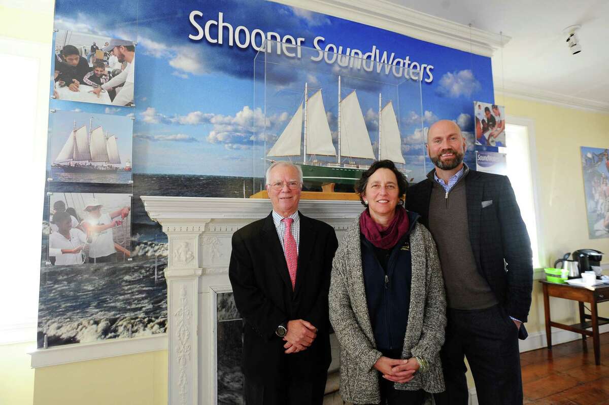 From left, Young Mariners chairman Tom O'Connell, SoundWaters president Dr. Leigh Shemitz and SoundWaters chairman Scott Mitchell pose for a picture inside the SoundWaters Coastal Education Center after announcing a merge between the two nonprofits which will enhance the educational opportunities offered to students in Stamford on Thursday, Jan. 21, 2016.