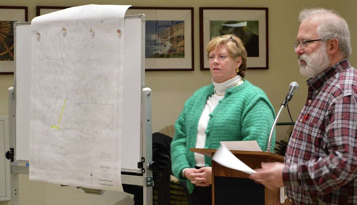 Colleen Kissane, chairwoman of the state's Scenic Road Advisory Committee, and John Suggs, RTM District 5, stand near a map marking the proposed section of Route 136 that could be designated a state scenic road if approved by the state Department of Transportation.