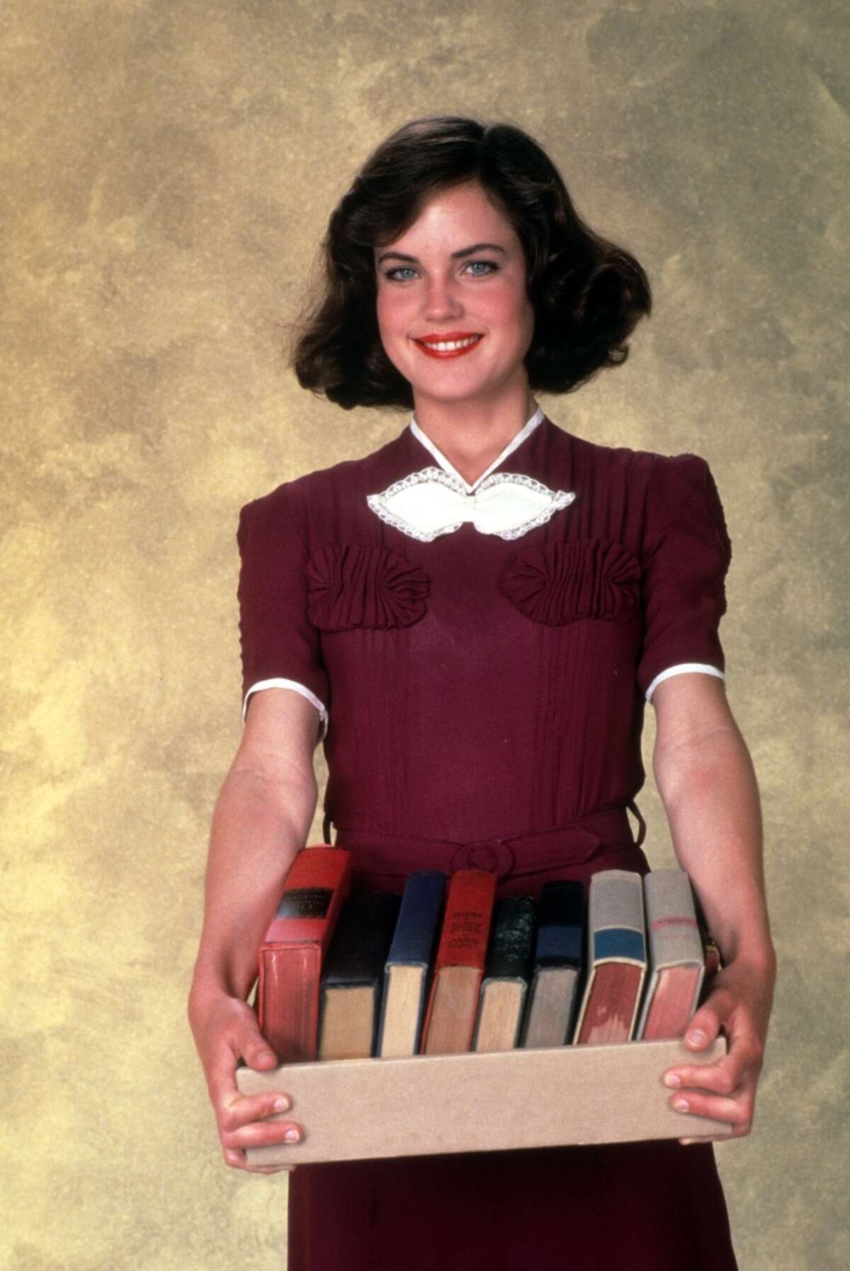Elizabeth McGovern holds books in publicity portrait for the film "Racing With The Moon" in 1984.