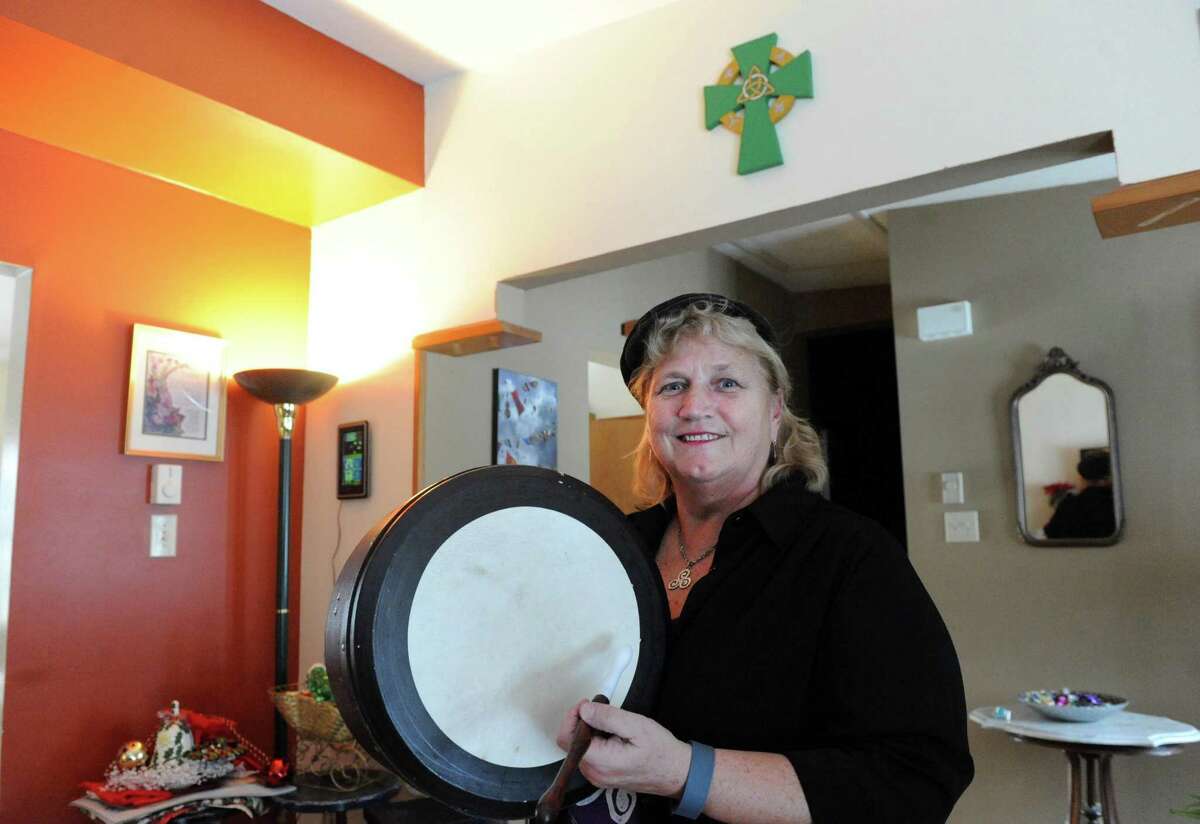 Noeleen Druckenmiller founder of the trio and Irish band Triskele at her home with the instrument she plays, an Irish drum called a bodhran, on Wednesday Jan. 20, 2016 in Troy, N.Y. (Michael P. Farrell/Times Union)