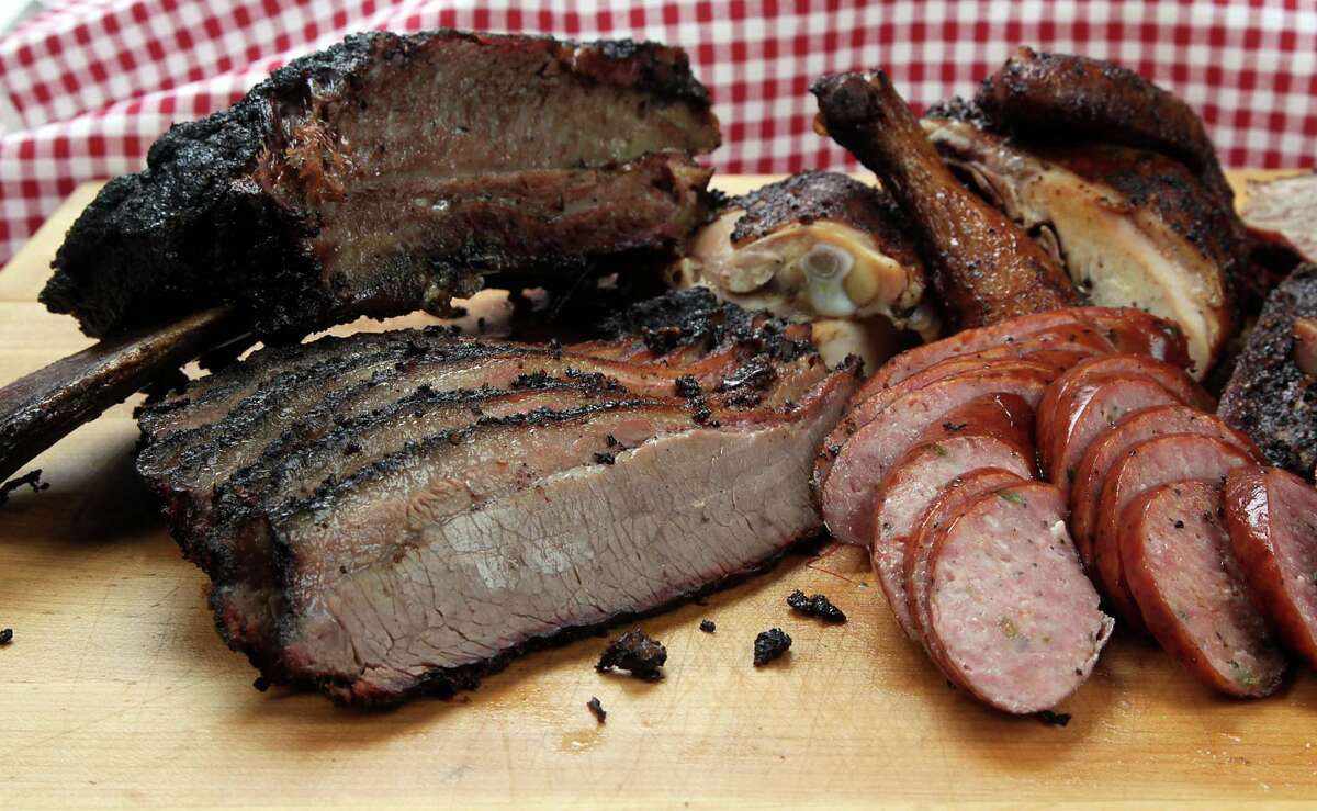 Barbecue brisket, sausage, chicken and beef rib from The Brisket House restaurant Thursday, April 17, 2014, in Houston. ( James Nielsen / Houston Chronicle )