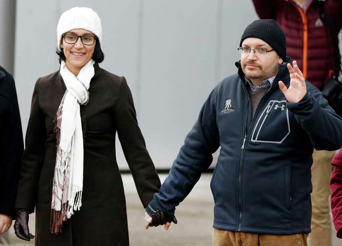 U.S. journalist Jason Rezaian and his wife Yeganeh Salehi hold hands as they pose for media people in front of Landstuhl Regional Medical Center in Landstuhl, Germany, last week. Rezaian was released from an Irani prison last Saturday.