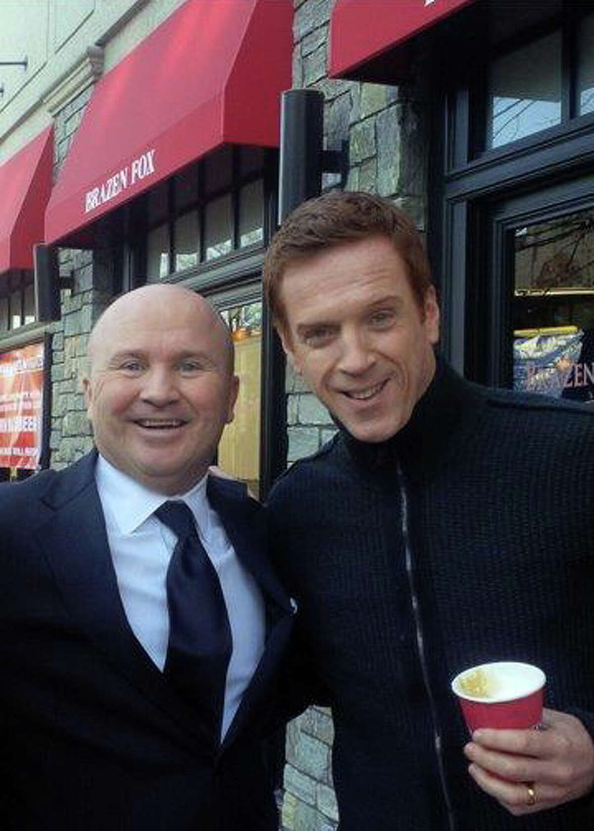Tony Capasso, maitre d' and managing partner at Gabriele’s Italian Steakhouse in Greenwich, with actor Damien Lewis on the set of “Billions,” which premiers on Showtime.
