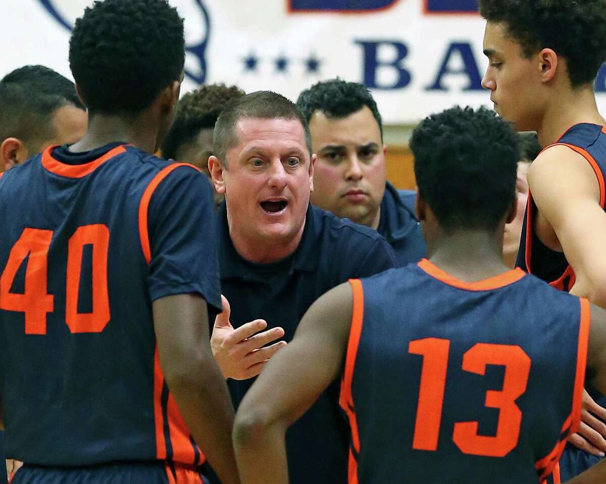 Coach Marc Gardner talks to the Broncos as Brandeis plays O'Connor in District 27-6A boys basketball at Taylor Field House on January 22, 2016.