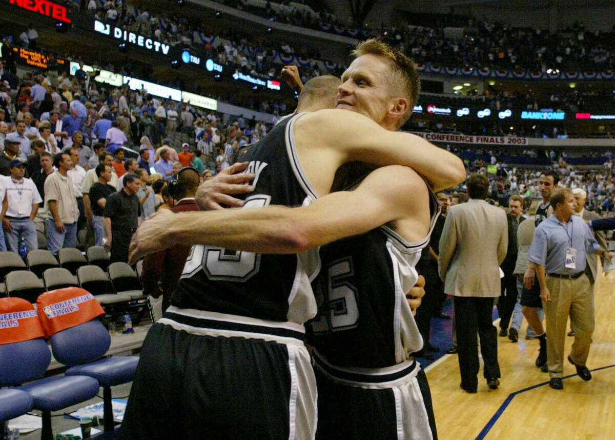 Forward Danny Ferry, left, celebrates with teammate Steve Kerr after the Spurs’ 90-78 victory over the Dallas Mavericks in Game 6 of the Western Conference finals in Dallas on May 29, 2003.