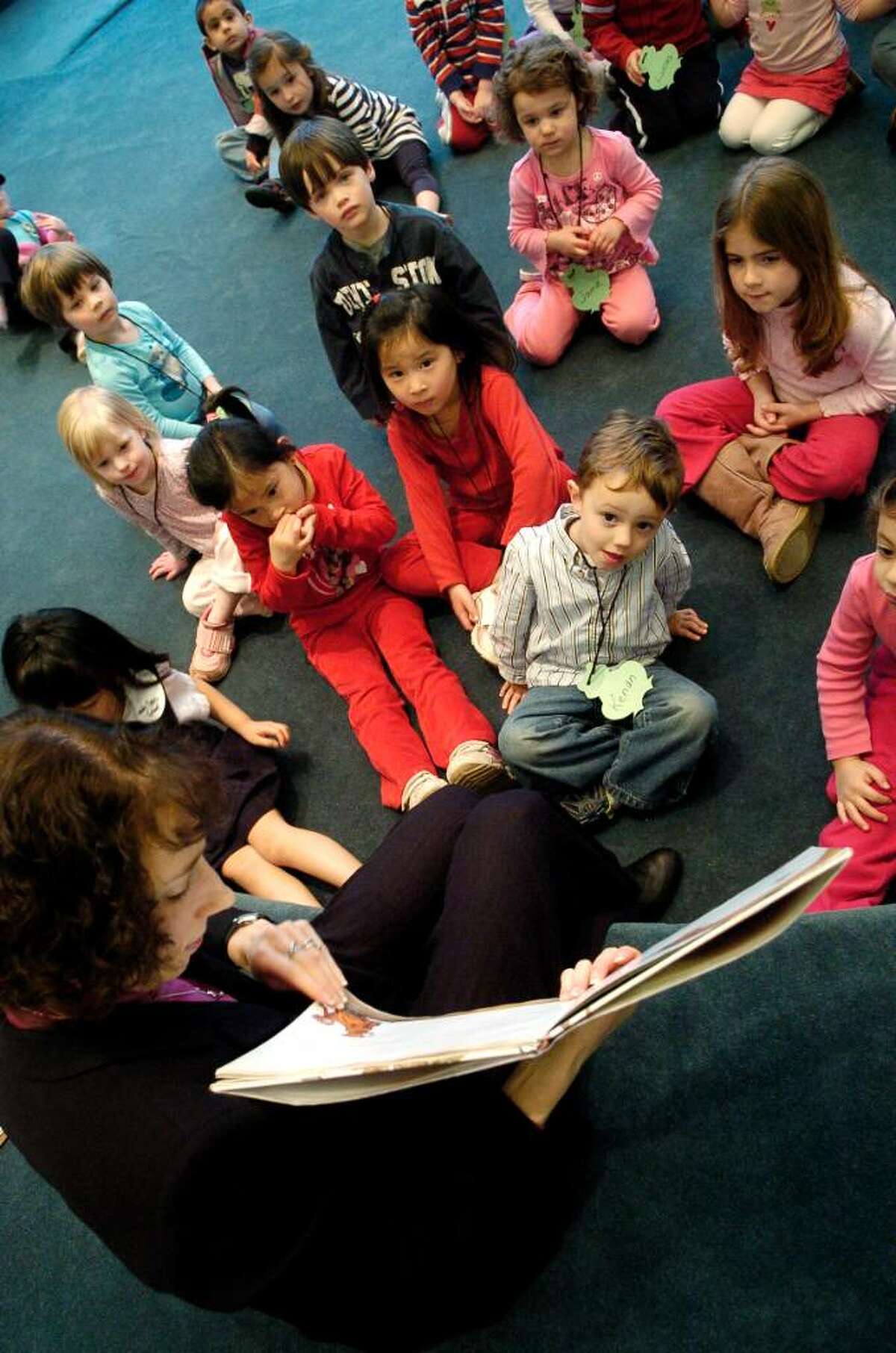 Children's librarian Amy Lolien-Harper reads to preschoolers during story hour at the Harry Bennett branch of the Ferguson Library in Stamford, Conn. on Monday March 22, 2010.