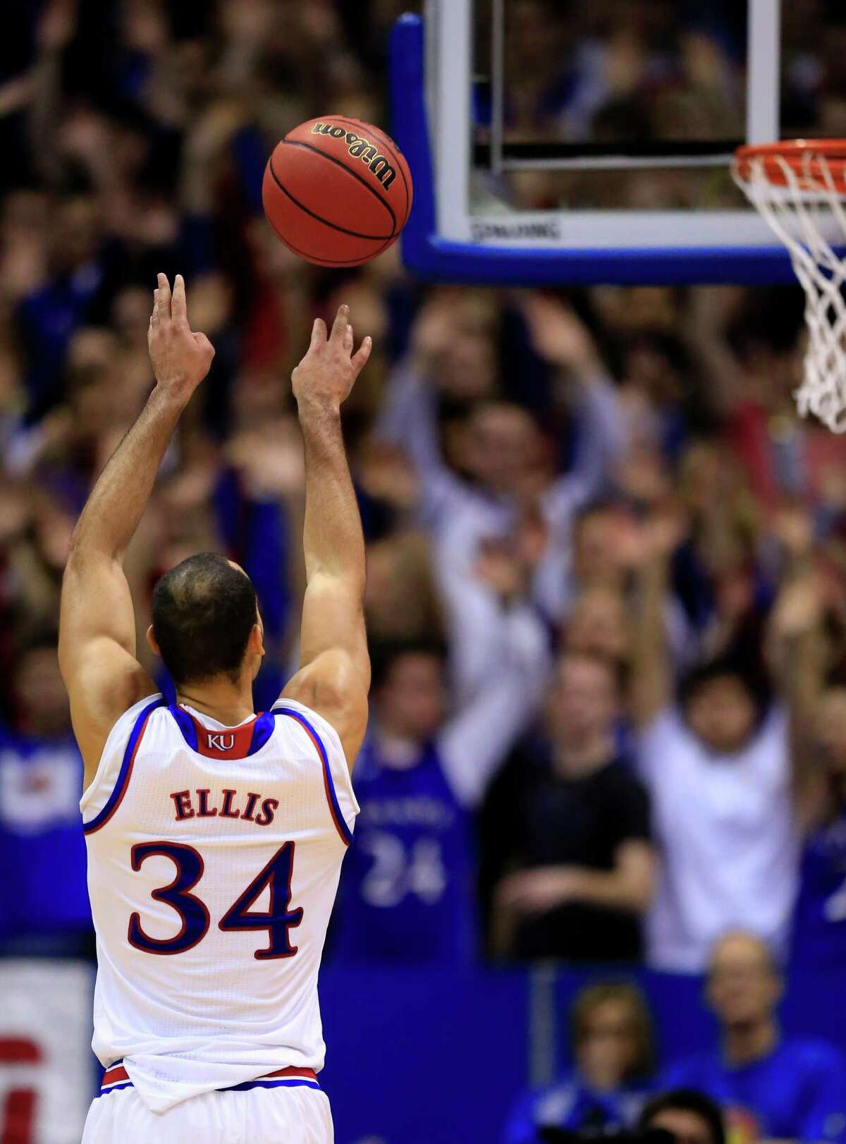 Kansas forward Perry Ellis (34) shoots a free throw late in the second half of an NCAA college basketball game against Texas in Lawrence, Kan., Saturday, Jan. 23, 2016. Ellis scored 26 points in the game. Kansas defeated Texas 76-67. (AP Photo/Orlin Wagner)