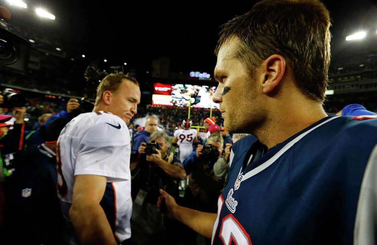 Tom Brady #12 of the New England Patriots and Peyton Manning #18 of the Denver Broncos greet each other at midfield following the game on October 7, 2012 at Gillette Stadium in Foxboro, Massachusetts. (Photo by Jared Wickerham/Getty Images)