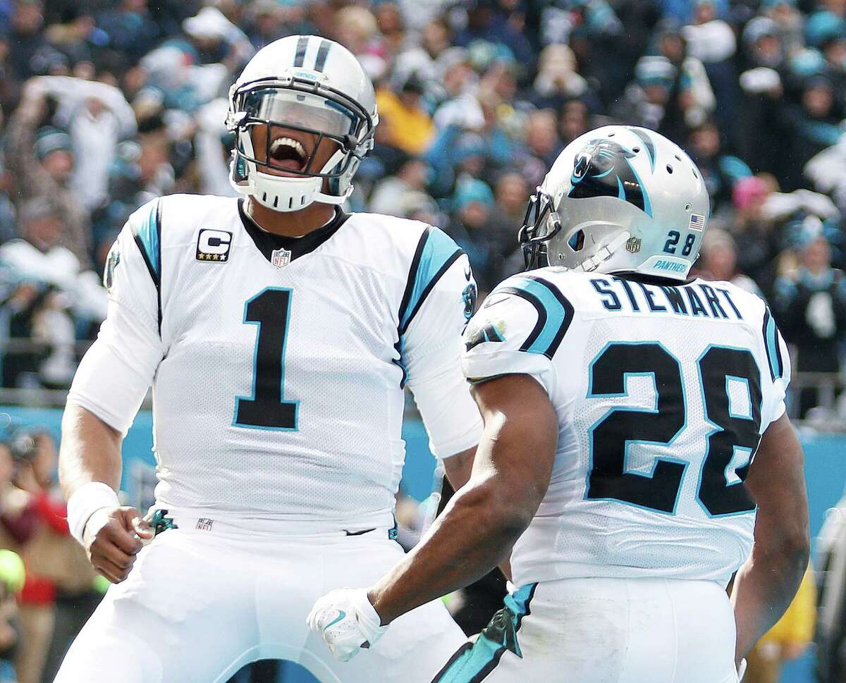 Carolina Panthers running back Jonathan Stewart (28) celebrates his touchdown with Carolina Panthers quarterback Cam Newton (1) against the Seattle Seahawks during the first half of an NFL divisional playoff football game, Sunday, Jan. 17, 2016, in Charlotte, N.C. (AP Photo/Bob Leverone)