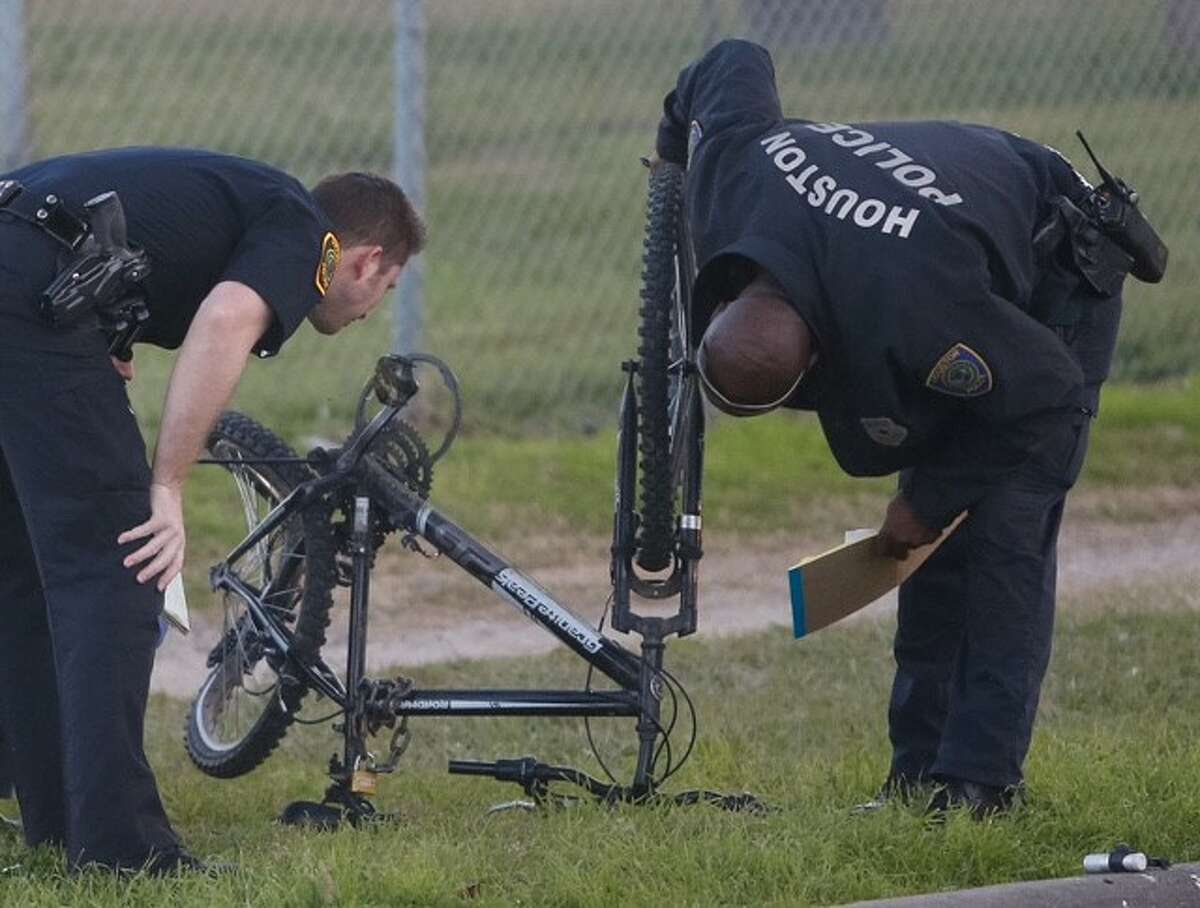 Houston Police inspect a damaged bicycle at the scene of an auto-pedestrian hit-and-run Jan. 25 in the 6200 block of Westpark Drive. |