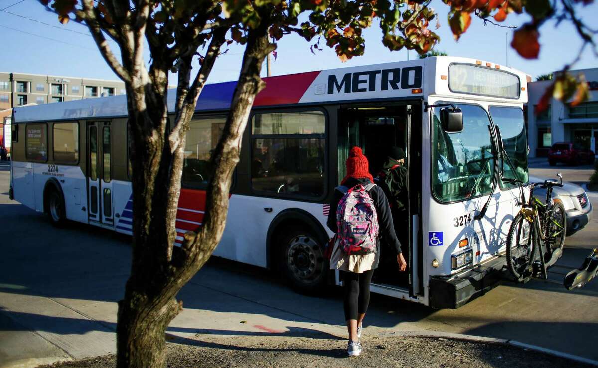A woman boards the 82 Westheimer bus at the intersection of Westheimer Road and South Shepherd Drive on Jan. 22. The Westheimer route is Metro's busiest since bus system changes in August.