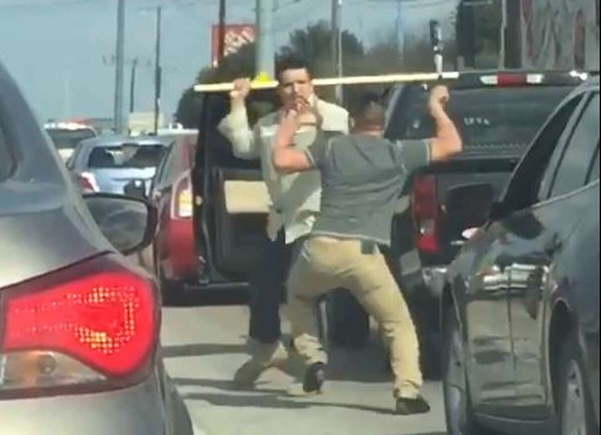 Cellphone footage captured by an Austin driver shows two men using weapons during a violent road rage confrontation in Austin on Monday.