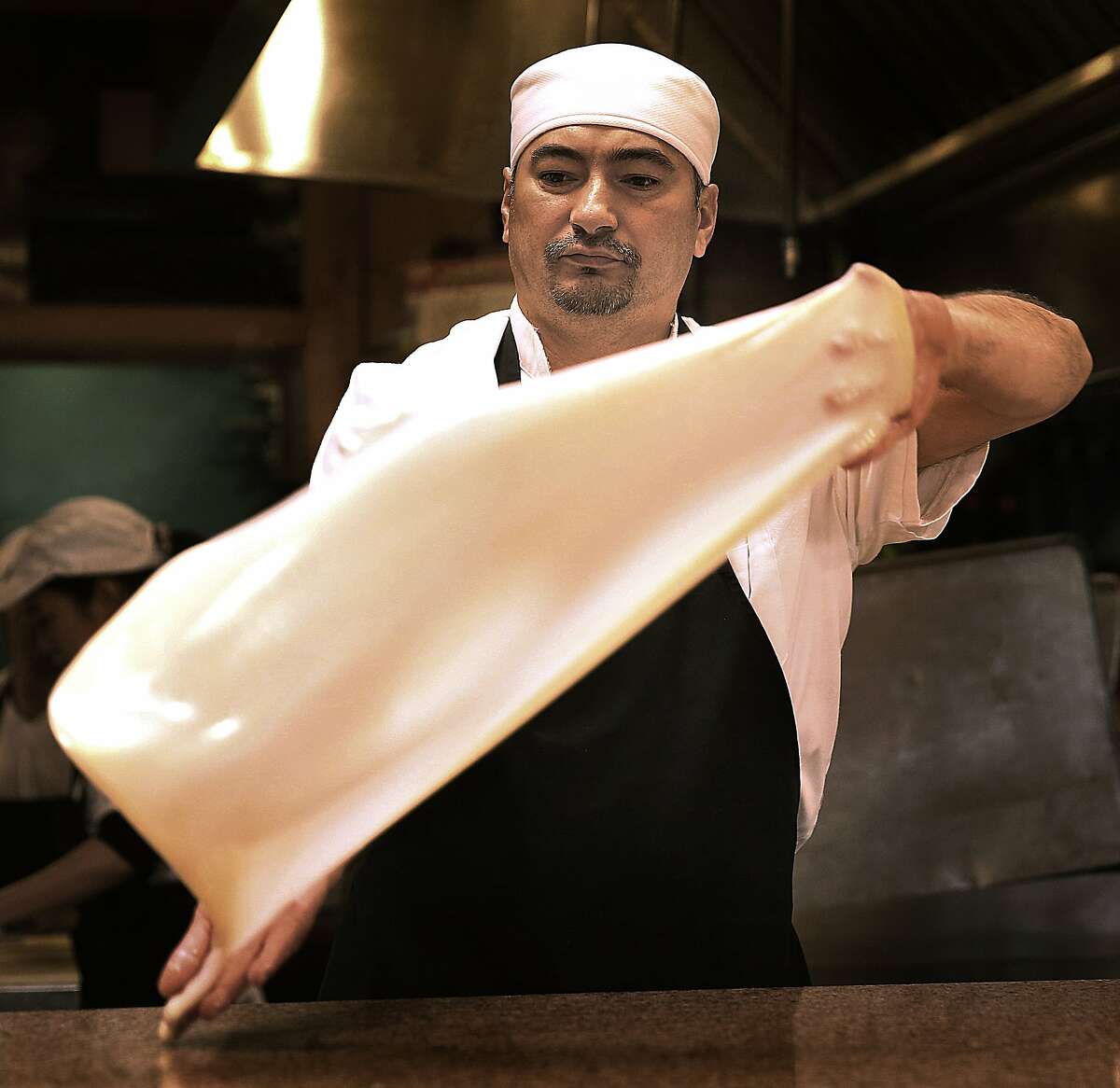 making-roti-canai-a-flaky-malaysian-flatbread-is-a-spectacle