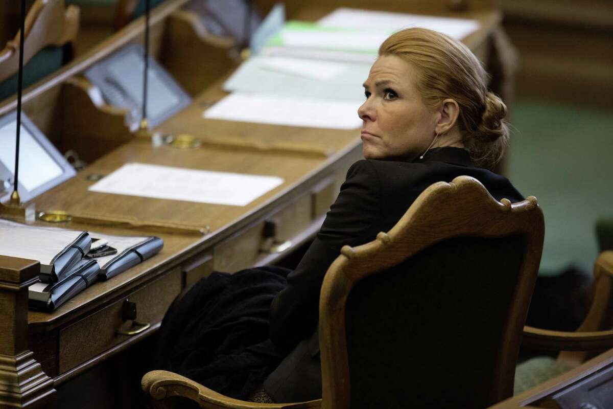 Denmark's Minister of Integration from the Liberal Party Inger Stoejberg sits in Parliament, in Copenhagen on Tuesday Jan. 26, 2016. Denmark's Parliament is expected to vote allow police seizing valuables worth more than $1,500 from asylum-seekers to help cover their housing and food costs while their cases were being processed. (Peter Hove Olesen/ POLFOTO via AP) DENMARK OUT