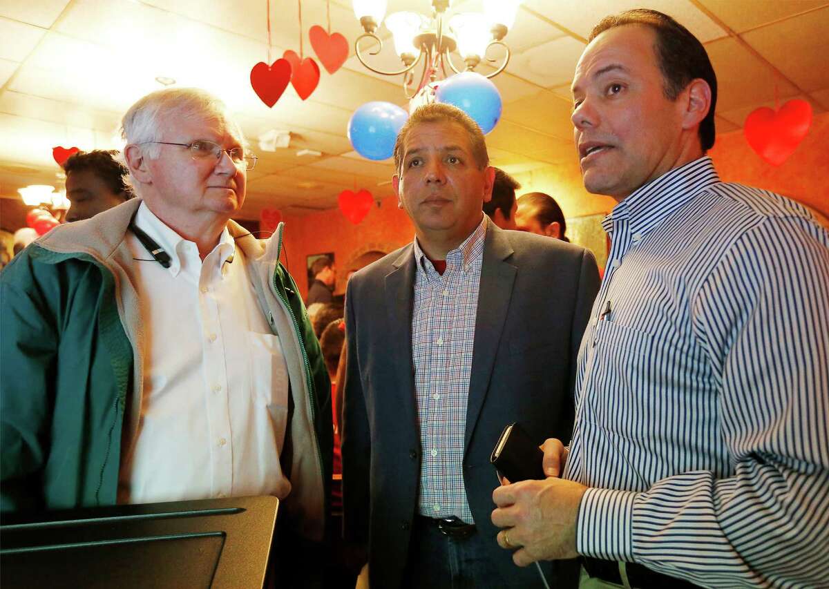 Republican candidate John Lujan (center) with Bexar County GOP Chairman Robert Stovall (right) discuss election results at Lujan's watch party on Don Pedro Mexican Restaurant on Tuesday, Jan. 26, 2016. Lujan is running against Democrat Tomas Uresti in the special runoff election for Texas House District 118. The winner will replace former state rep. Joe Farias. (Kin Man Hui/San Antonio Express-News)