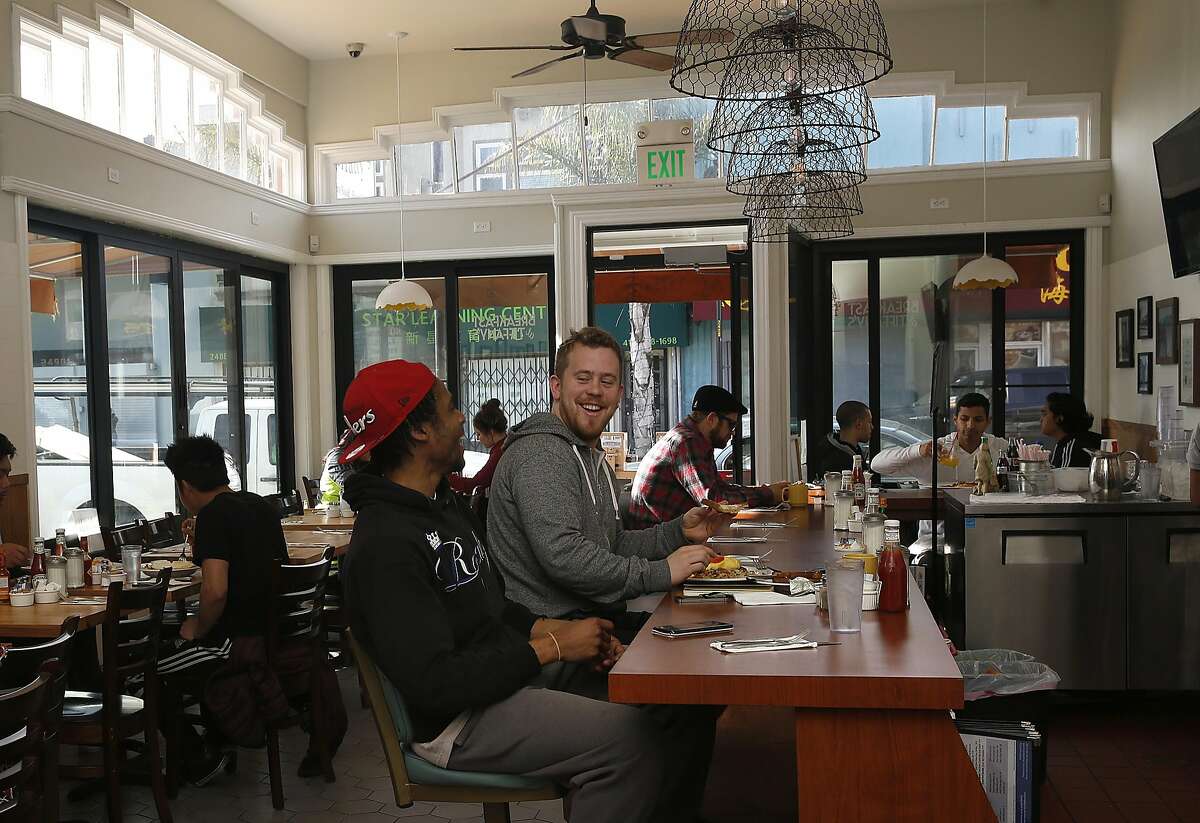 Bobby Morgan (front) and Evan McSweeney (middle) sit at the counter at Breakfast at Tiffany's in San Francisco, California, on Tuesday, January 25, 2016. Morgan was a busboy at the restaurant when he was 15 years old and used to cook with the present chef after high school.