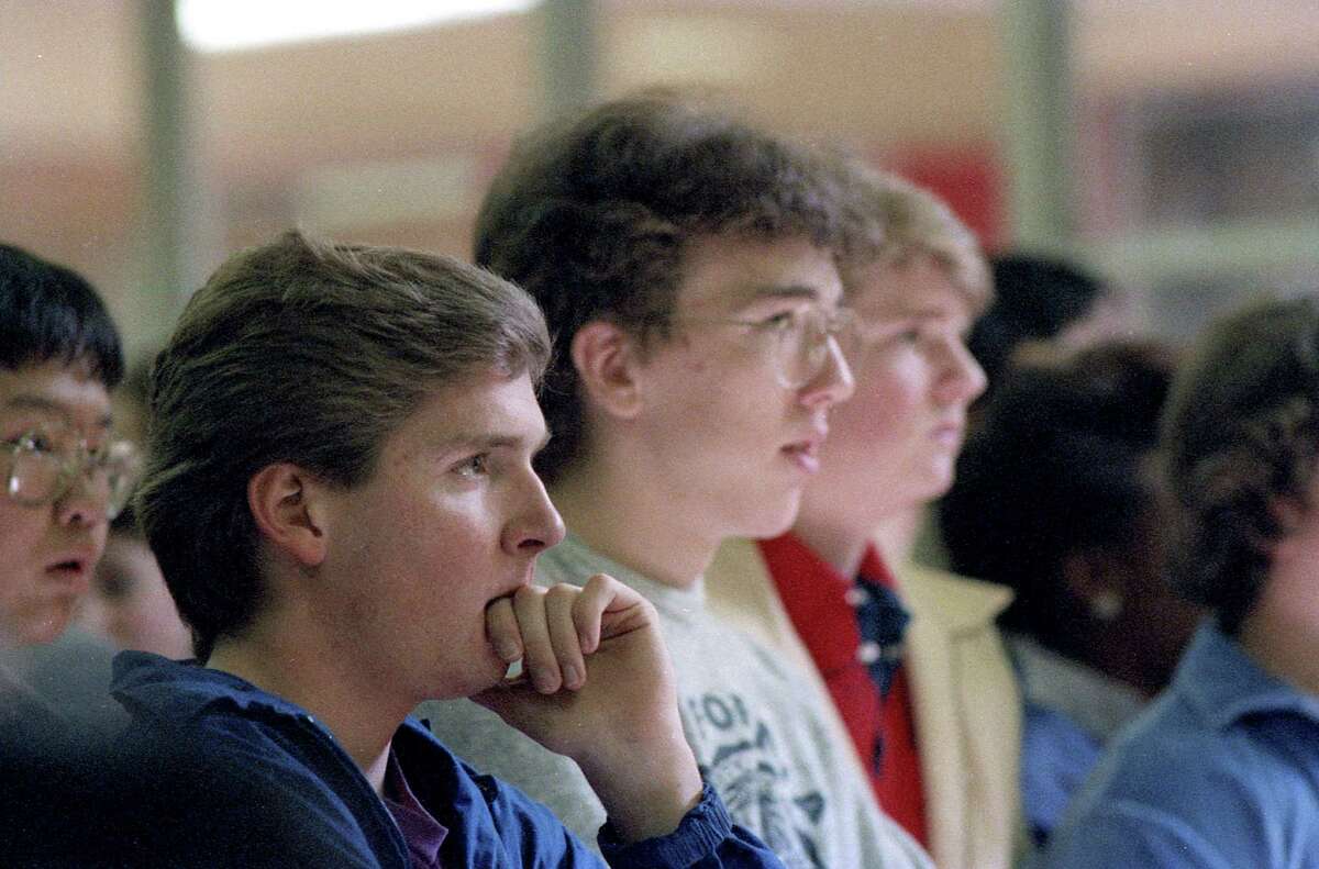 Robert Barrett, 17, watches news reports of the Challenger explosion with his classmates at Bellaire High School, Jan. 28, 1986.