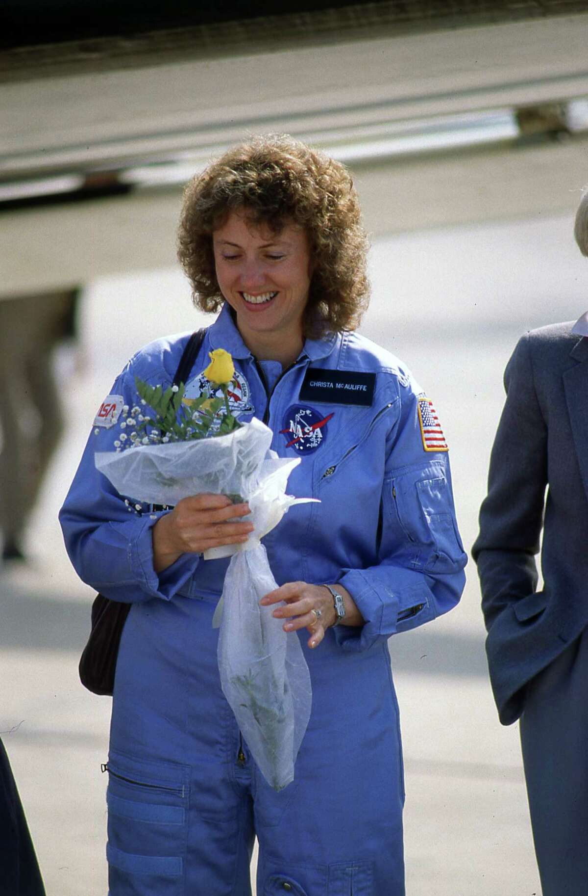 Teacher-astronaut Christa McAuliffe prepares to leave Ellington Field for the Kennedy Space Center, Jan. 23, 1986.
