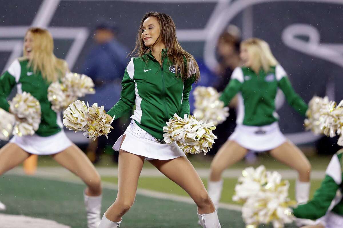 New York Jets cheerleaders perform during the first half of an NFL football...
