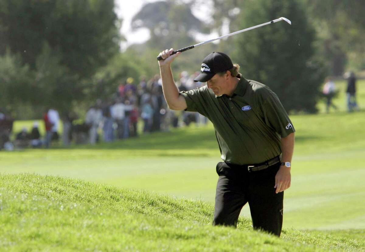 Phil Mickelson laments a poor bunker shot during another round that got away from him at Torrey Pines, a 73 on Sunday in 2006, as he faded from contention to eighth place in the PGA Tour stop.