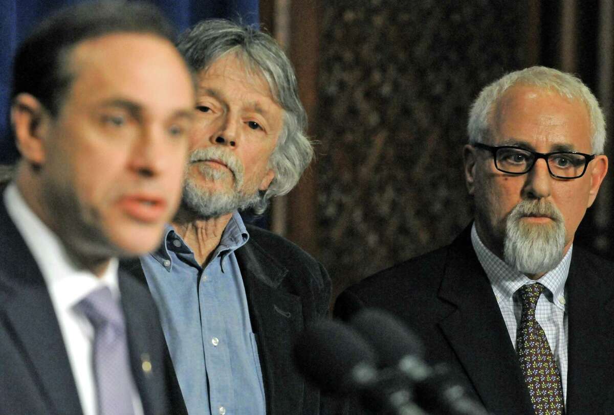 Howard Zucker, state health commissioner, left, speaks as Hoosick Falls Mayor David Borge, center, and school superintendent Kenneth Facin listen about state action on the Hoosick Falls water pollution during a press conference following a meeting with Gov. Andrew Cuomo at the Capitol on Wednesday Jan. 27, 2016 in Albany, N.Y. (Michael P. Farrell/Times Union)