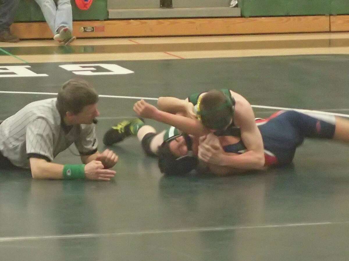 New Milford's Brandon Leonard, top, pinned New Fairfield's Hunter Chin to win the 106-pound match and help lead the Green Wave to a 41-28 victory in their dual meet on Jan. 27, 2016.