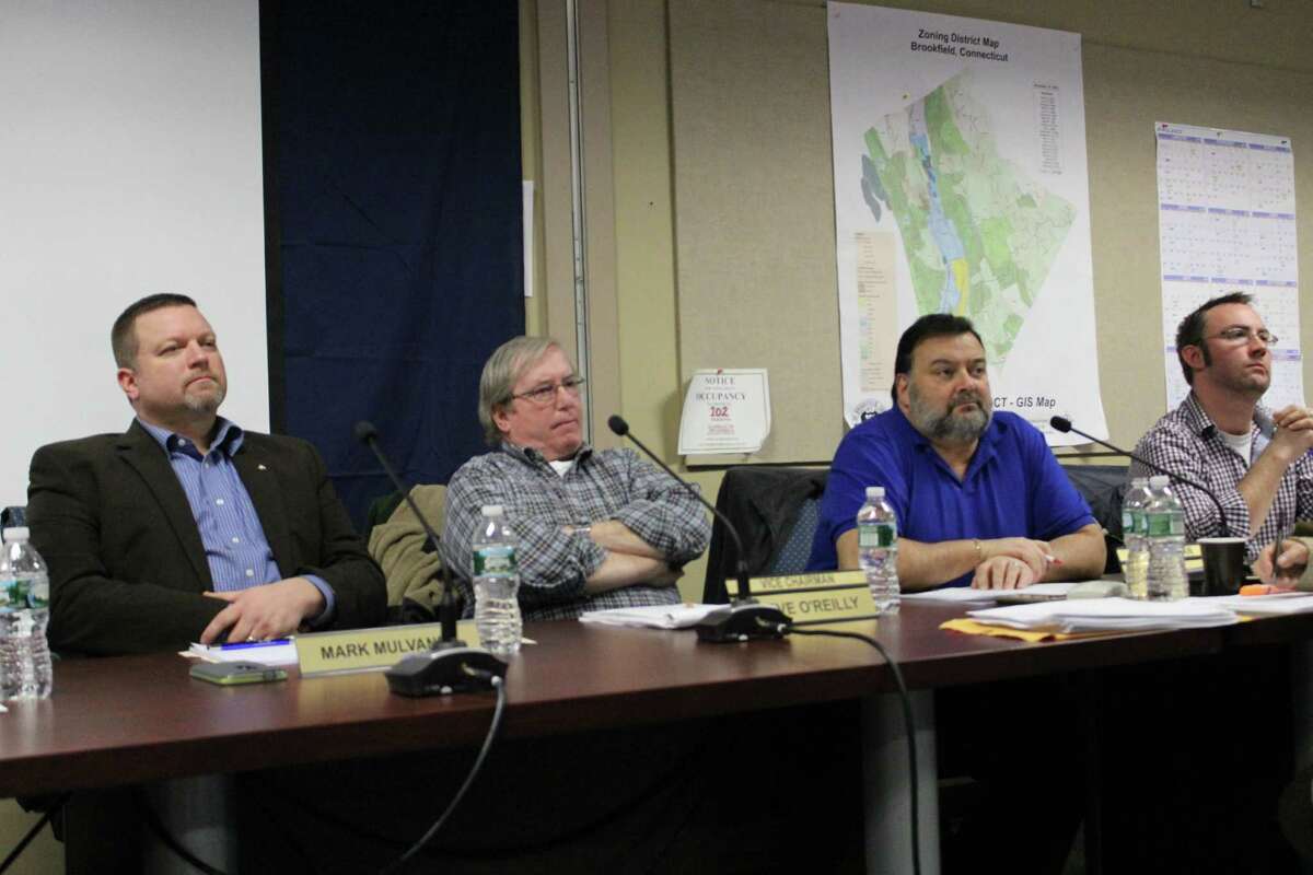 Board of Finance member Mark Mulvaney, Vice Chairman Steve O’Reilly, Chairman Rob Gianazza and member Sean Hathorn listen as Brookfield, CT residents speak in favor of town Controller Bill Leverence on Weds., Jan. 27, 2016.