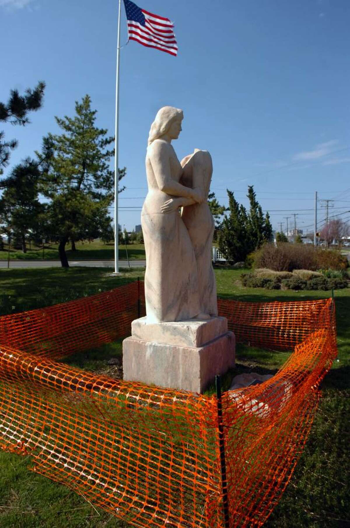 "Neighbors," a depression era statue by Henry Kreis,in Czecik Marina Park is fenced off Monday afternoon, April 5, 2010. The statue was damaged when the head of one of the women was cut off and taken. The work depicts two women embracing and was funded by the Works Progress Administration, an agency created to generate jobs in the late 1930s.