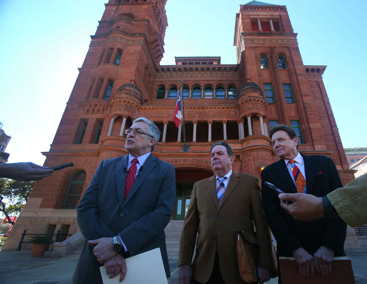 Attorneys Allan E. Parker, (left) George LeGrand (center) and Stanley Bernstein (right) stand in front of the Bexar County Courthouse Thursday January 28, 2016 during a press briefing at which they announced their client is suing Tom Benson Chevrolet and Ernesto Davila, who at the time was her manager. Their client, Stephanie Cordero, alleges that Davila coerced her into having an abortion.