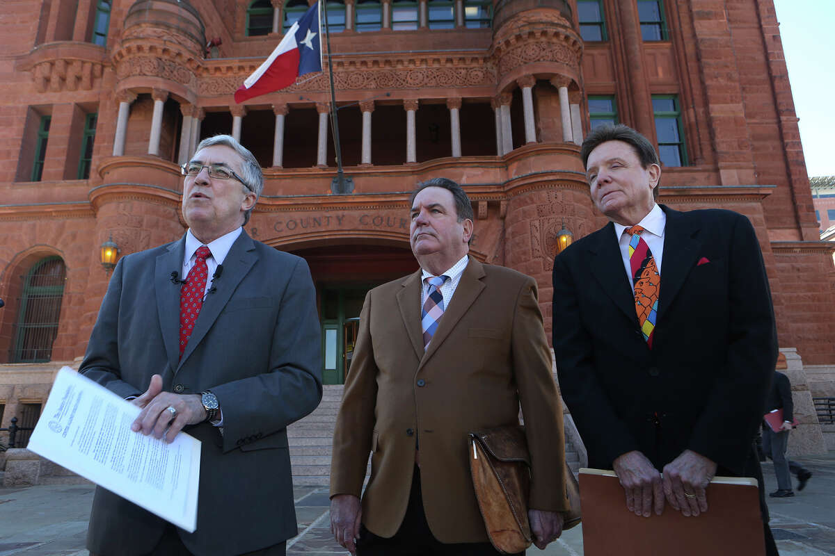Attorneys Allan E. Parker, (left) George LeGrand (center) and Stanley Bernstein (right) stand in front of the Bexar County Courthouse Thursday January 28, 2016 during a press briefing at which they announced their client is suing Tom Benson Chevrolet and Ernesto Davila, who at the time was her manager. Their client, Stephanie Cordero, alleges that Davila coerced her into having an abortion.
