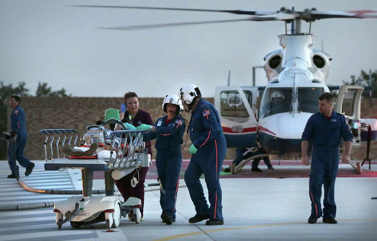 The Air Life medical crew transport a patient from their helicopter to University Hospital in 2014. Air Life has seen an increase in calls for trauma victims in the Eagle Ford Shale oil and gas production area.