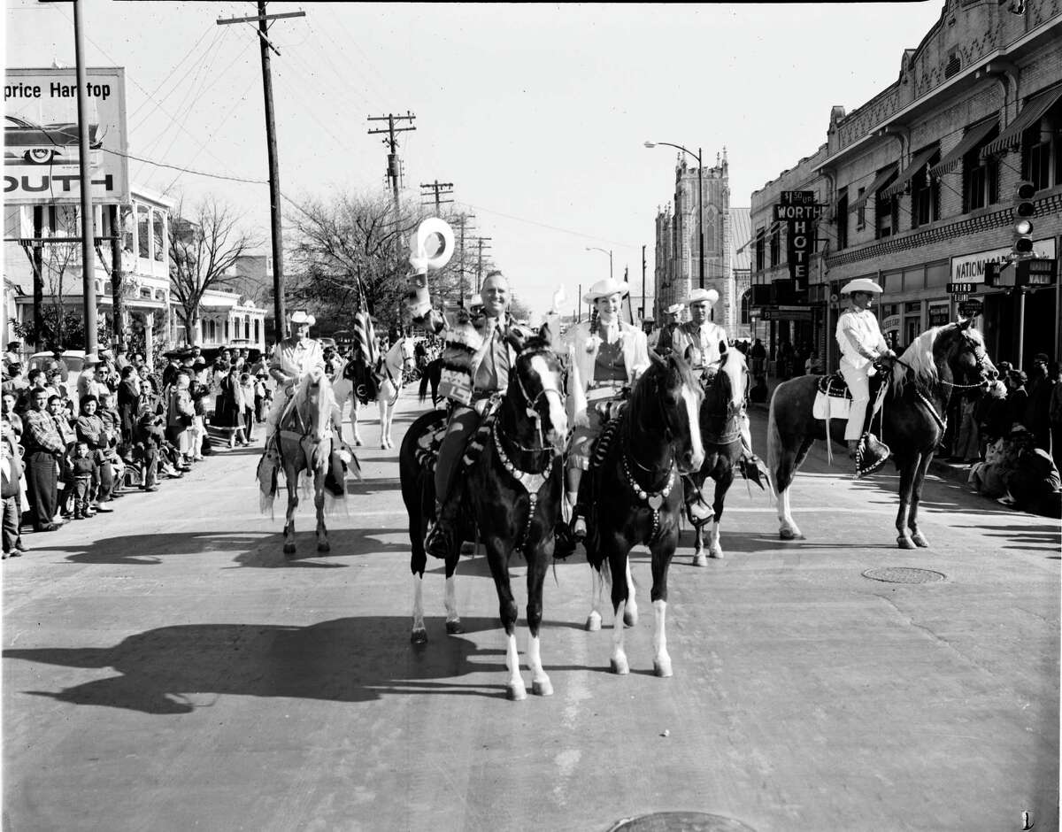 Gene Autry and Gail Davis "Annie Oakley" lead the western parade that officially opens the Stock Show and Rodeo, Feb. 7, 1958.