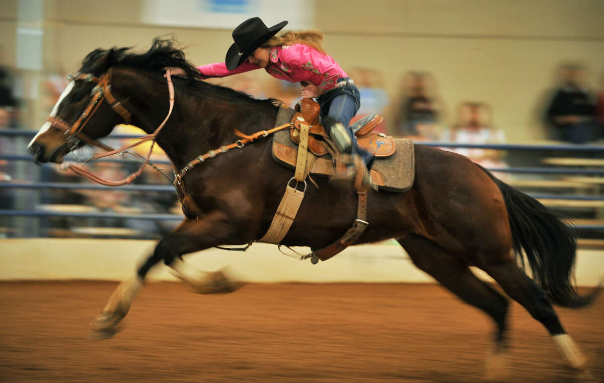 Kalli Davis and her horse, Bugging Dr. Nick Bar, compete during the open barrel racing competition Feb. 6, 2009, at the San Antonio Stock Show & Rodeo.