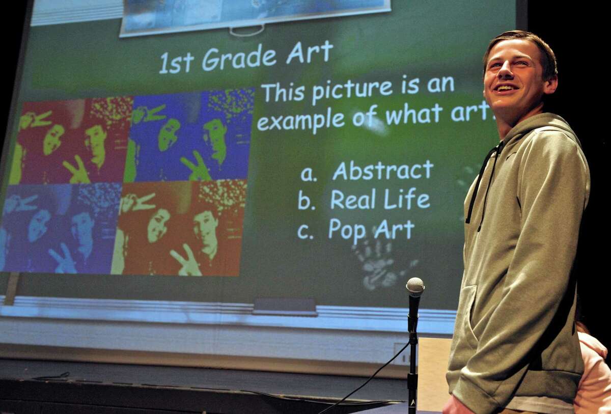 New Milford High School junior Kory Cyr, 16, looks to the audience for help with a question as he competes with 5th graders from Sarah Noble Intermediate School during a round of "Are You Smarter Than A Fifth Grader" presented by NMHS DECA. Thursday night, January 28, 2016, in New Milford.
