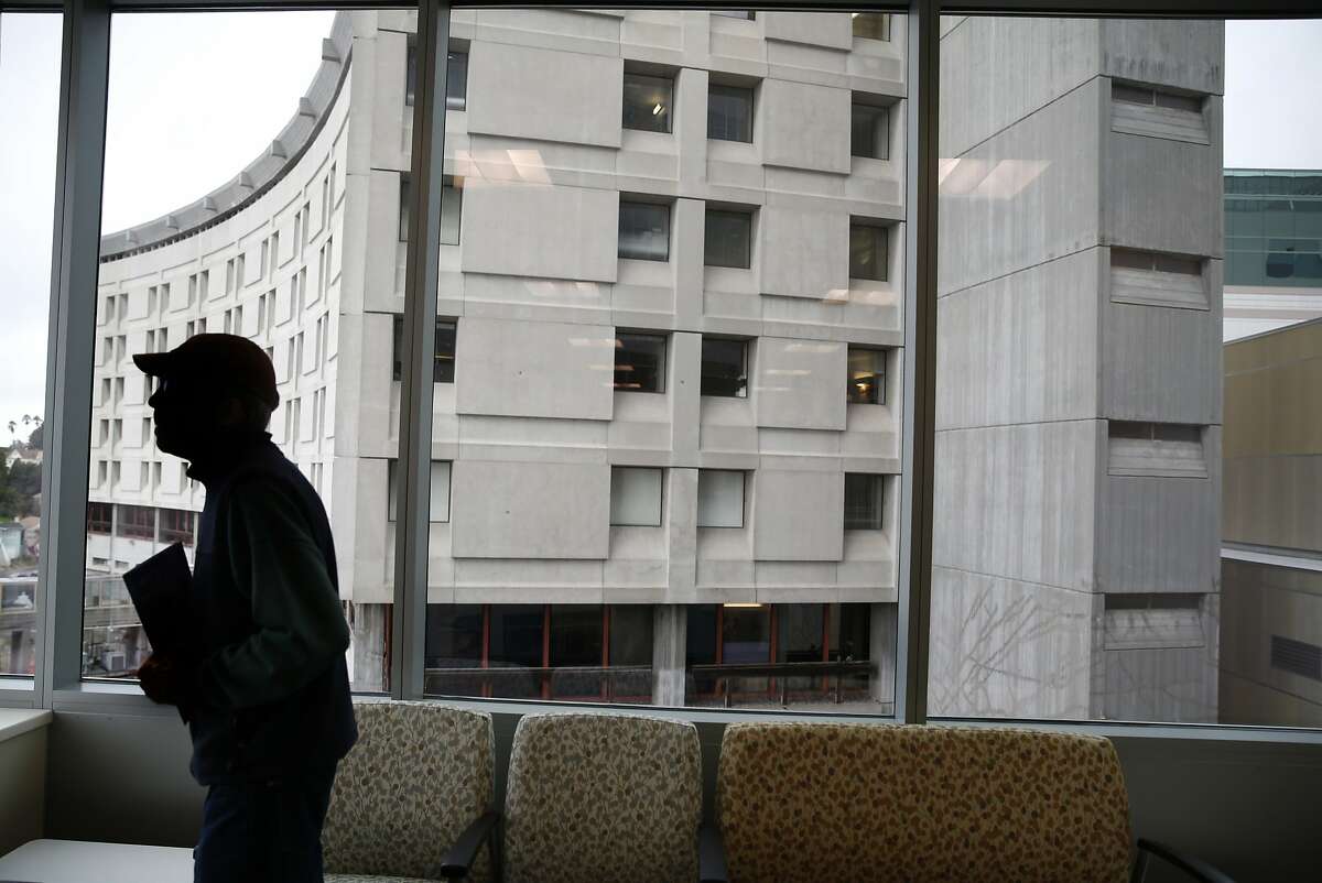 A guest touring the new Acute Care Tower visits a family waiting room in front of the soon-to-be demolished original 1968 building at Highland Hospital in Oakland, Calif. on Friday, Jan. 29, 2016.