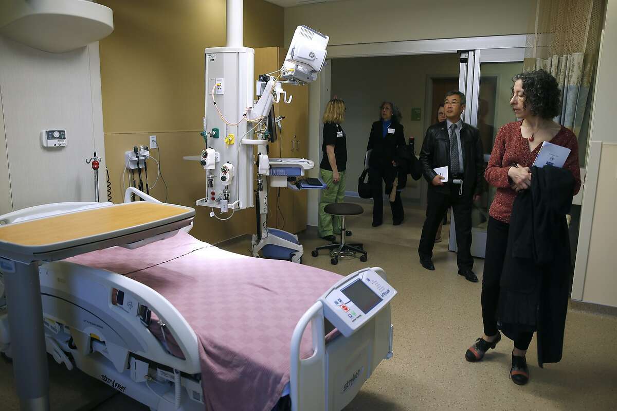Linda Katz (right) tours the intensive care unit on the 5th floor of the new Acute Care Tower at Highland Hospital in Oakland, Calif. on Friday, Jan. 29, 2016.