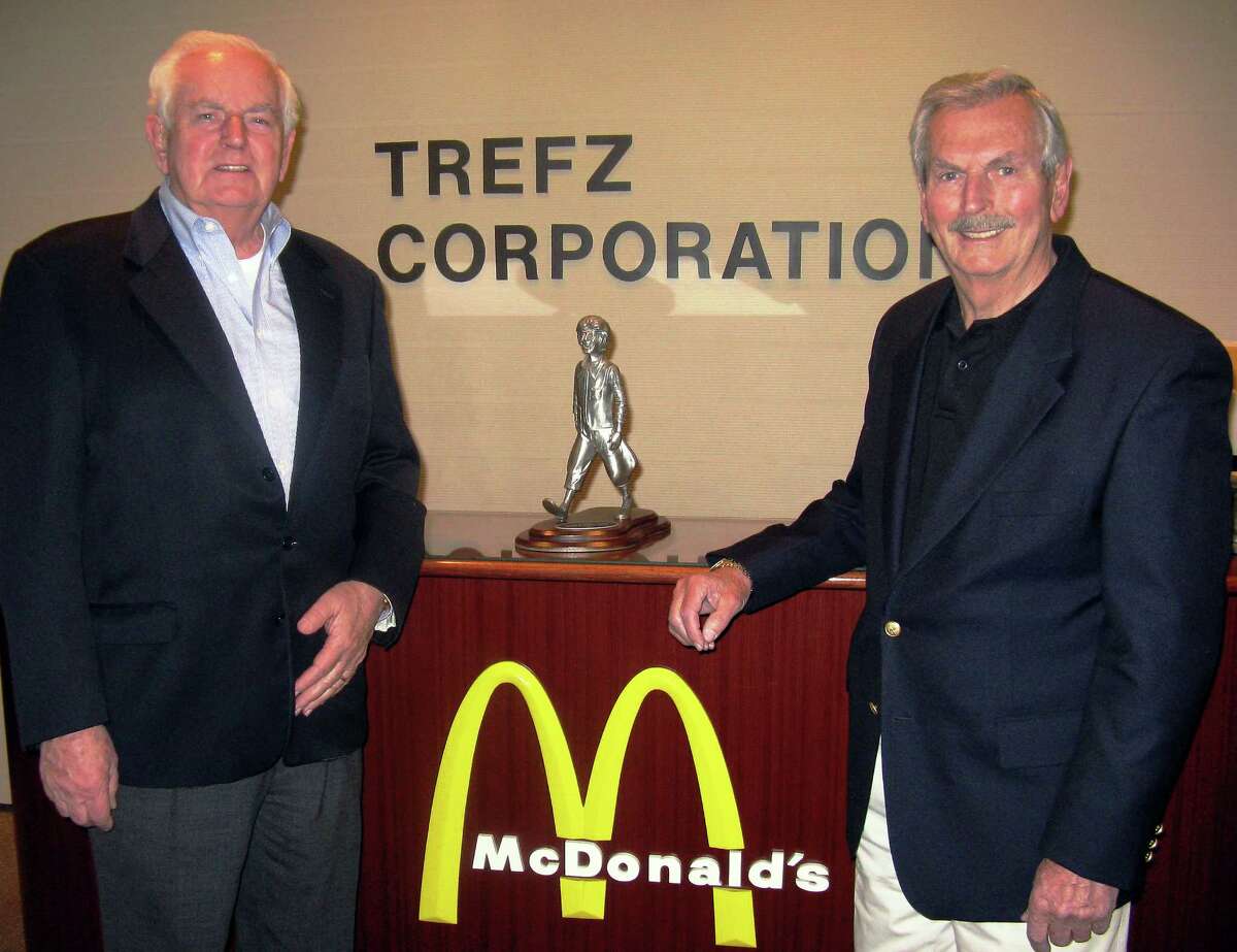 Chris, left, and Ernie Trefz receiving the Golden Arch Award in April at McDonald’s Worldwide Convention in Florida. The McDonald’s on Main Street in Bridgeport, owned by the Trefz Corp., is closing its doors.