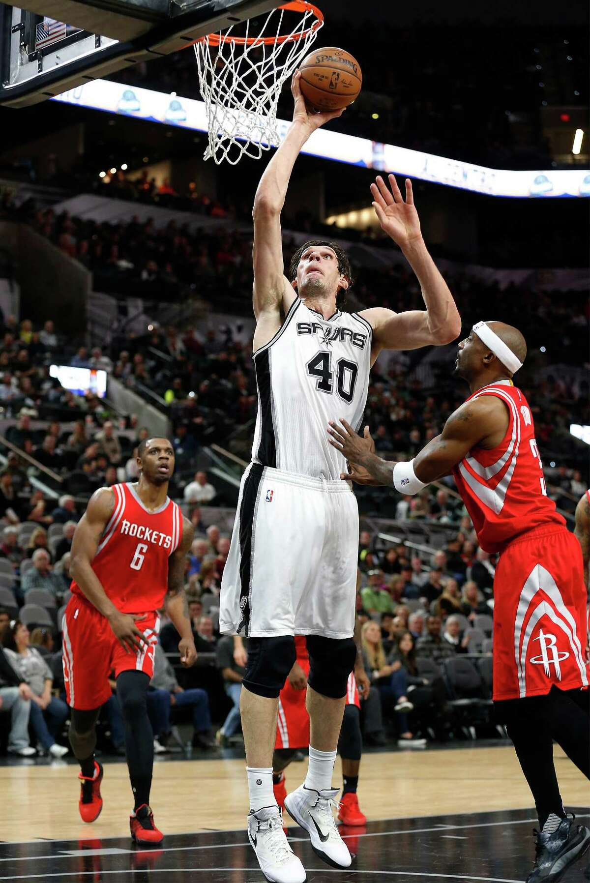 Spurs' Boban Marjanovic (40) goes up to score against Houston Rockets' Jason Terry (31) at the AT&T Center on Wednesday, Jan. 27, 2016. Spurs defeated the Rockets, 130-99. (Kin Man Hui/San Antonio Express-News)