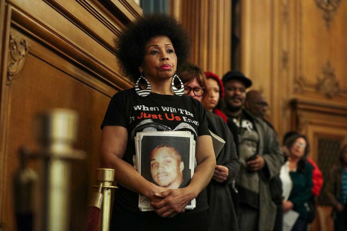 Mattie Scott (center), waits in line to speak in front of the Board of Supervisors at City Hall in San Francisco, California on Tuesday, January 12, 2016. Mattie Scott advocates for better gun control as her son was murdered in 1996 due to gun violence.