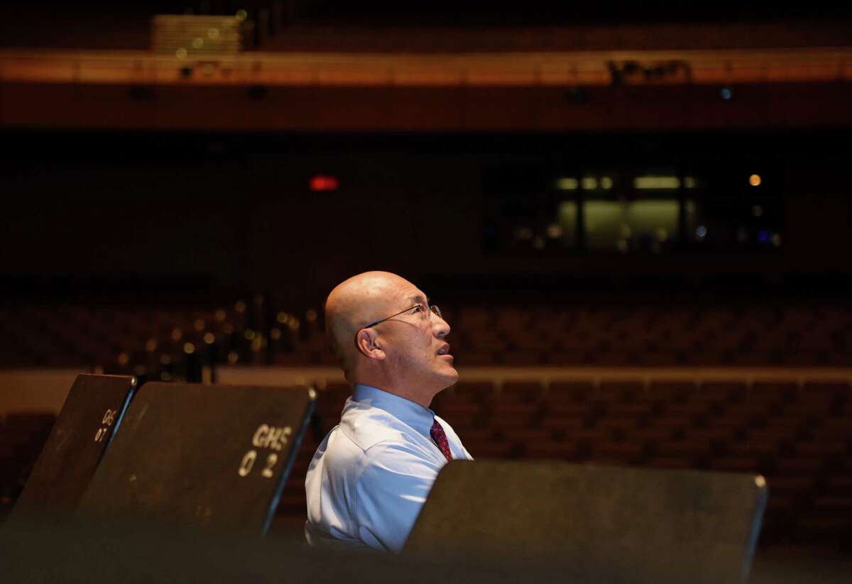 GHS Band Director John Yoon looks around at the new Greenwich High School MISA Auditorium in Greenwich, Conn. Monday, Jan. 25, 2016. Yoon was reinstated last month after serving a suspension since April of 2015 for allegedly mistreating two students. After nine public appeal hearings, board members ultimately decided that they did not have enough evidence of wrongdoing by Yoon and had too many concerns about administratorsâÄô handling of his case to justify firing him.