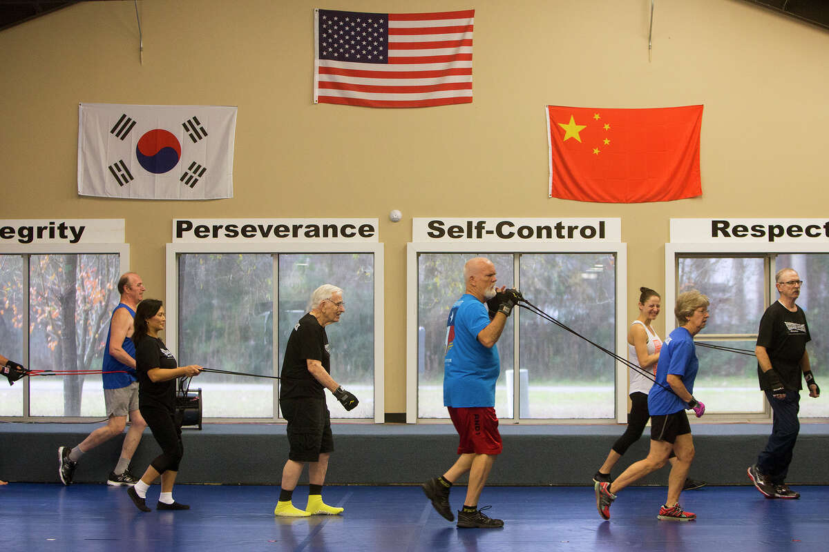 Participants workout during a boxing class for people with Parkinson's disease at Battenberg's Blackbelt Academy, Inc, Thursday, Jan. 21, 2016, in Kingwood.
