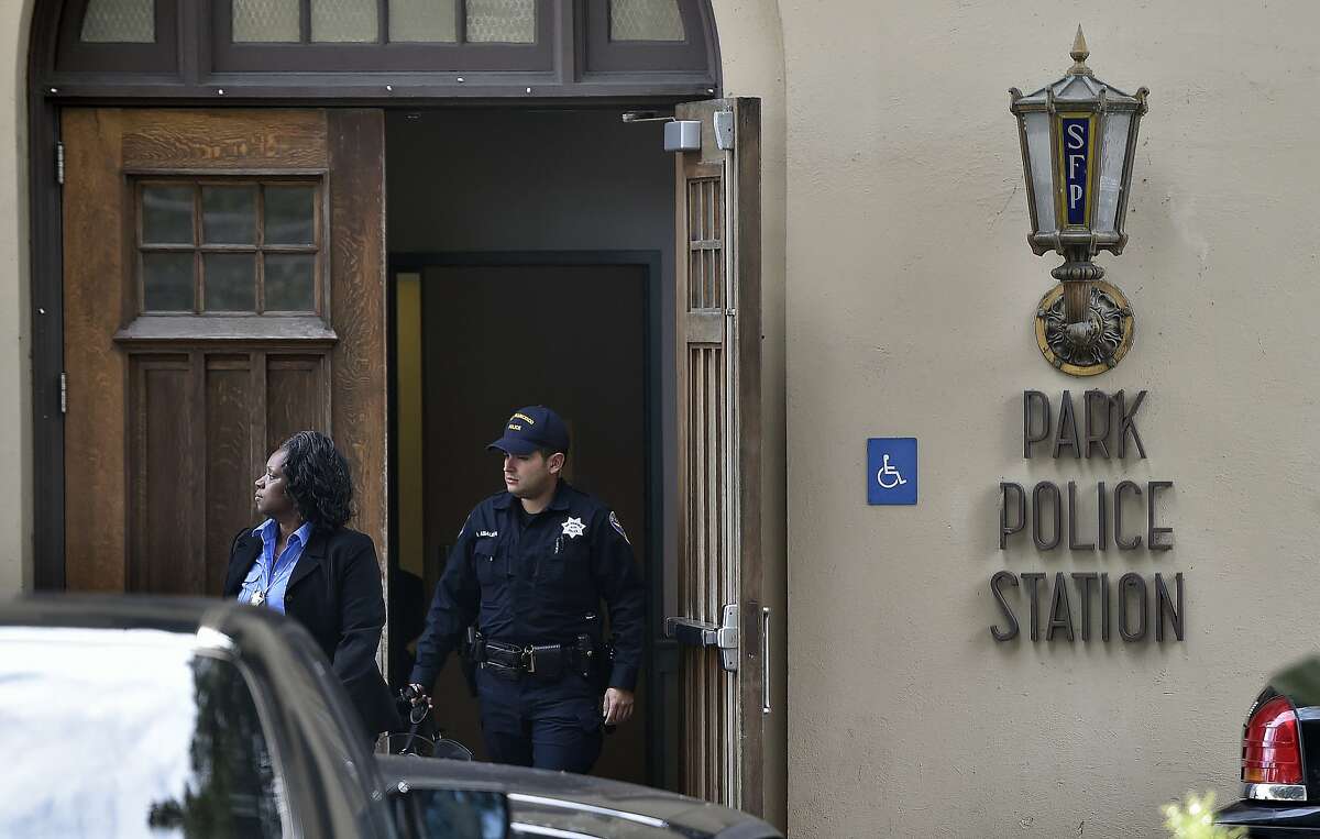 Police officers exit a police station after SFPD caught up with two fugitives near a McDonald's restaurant at the corner of Haight and Stanyan and arrested them in San Francisco on Jan. 30, 2016. The two men escaped from an Orange County prison and fled before being caught.