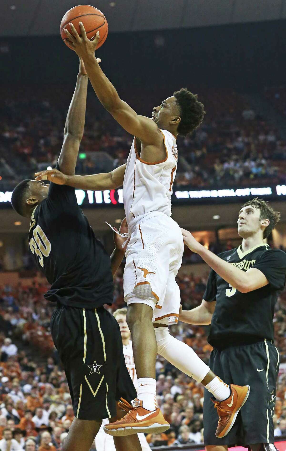 Isaiah Taylor flies into the rim for a score against Damian Jones as Texas hosts Vanderbilt at the Erwin Center in Austin on January 30, 2016.